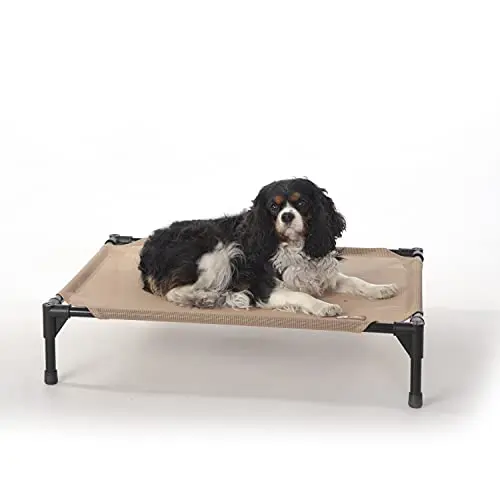 K&H tan mesh elevated dog cot on a deck